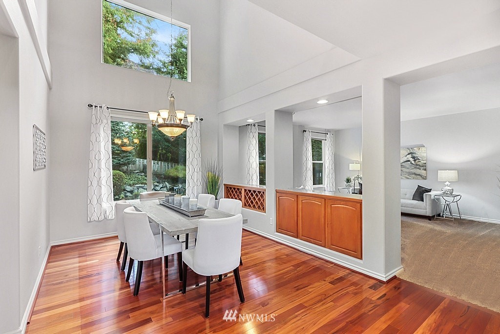 27714 Maple Ridge Way Southeast Maple Valley, WA 98038 - Photo 10 of 38 a view of a dining room with furniture window and wooden floor