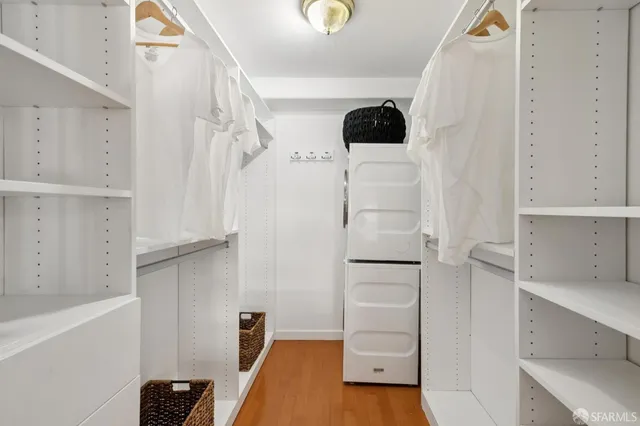 a view of walk in closet with white walls