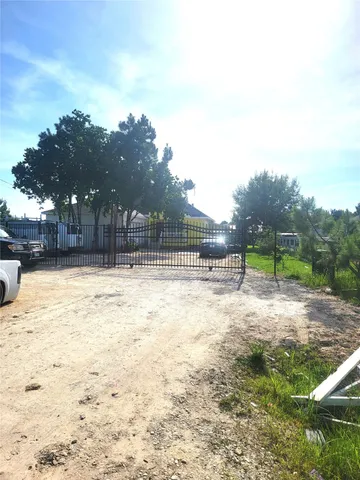 a swimming pool with outdoor seating and yard