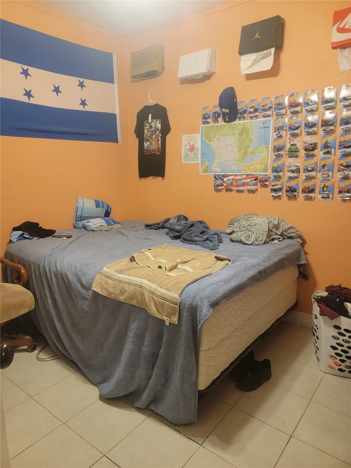 156 Road 5111 Cleveland, TX 77327 - Photo 11 of 13 a bed sitting in a bedroom next to a bathroom with a sink and a mirror