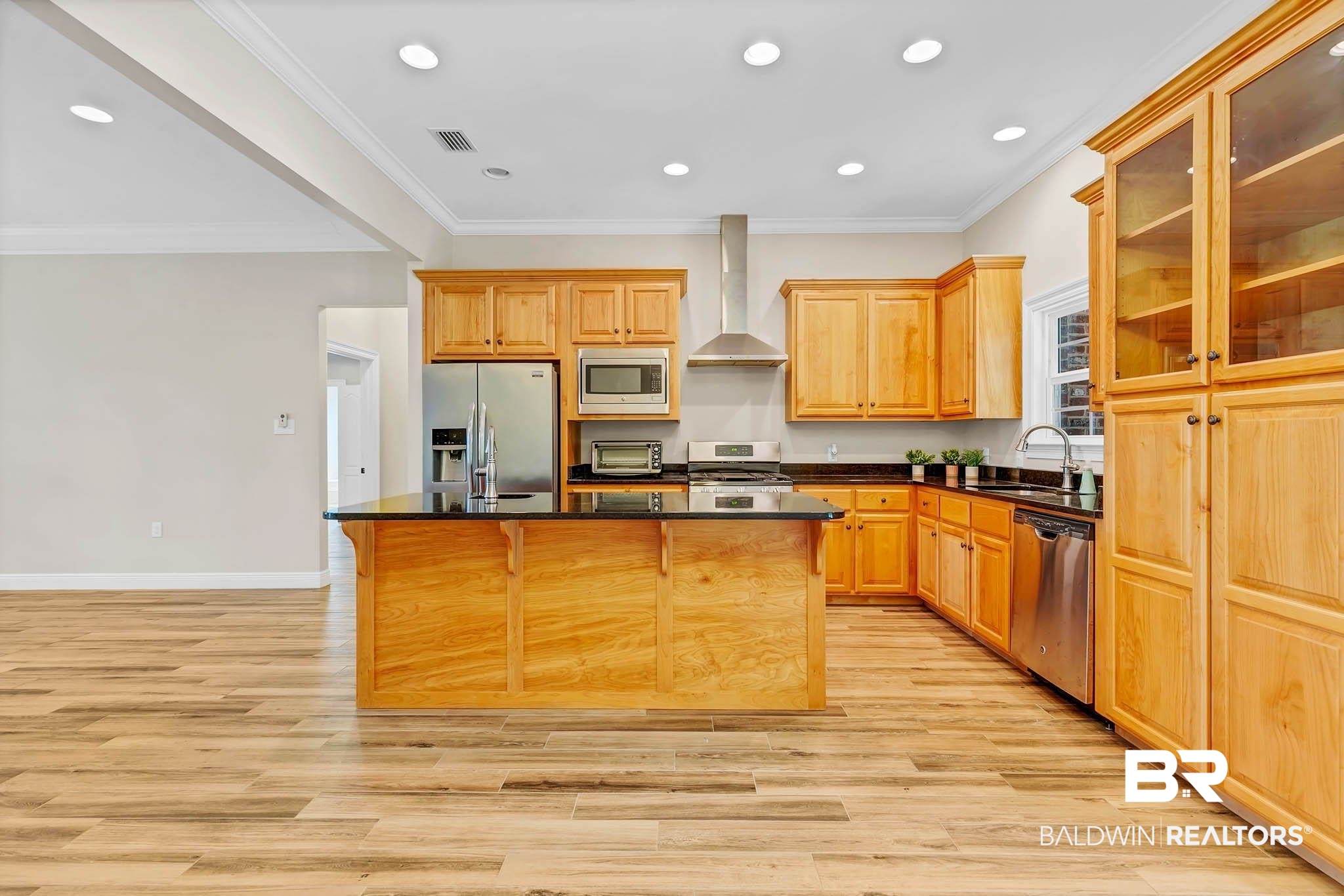 8145 Bay View Drive Foley, AL 36535 - Photo 18 of 81 Kitchen with stainless steel appliances, wall chimney exhaust hood, a kitchen island, light wood-type flooring, and recessed lighting