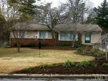 1410 Ashburton Road Raleigh, NC 27606 - Photo 1 of 1 a view of a house with a yard