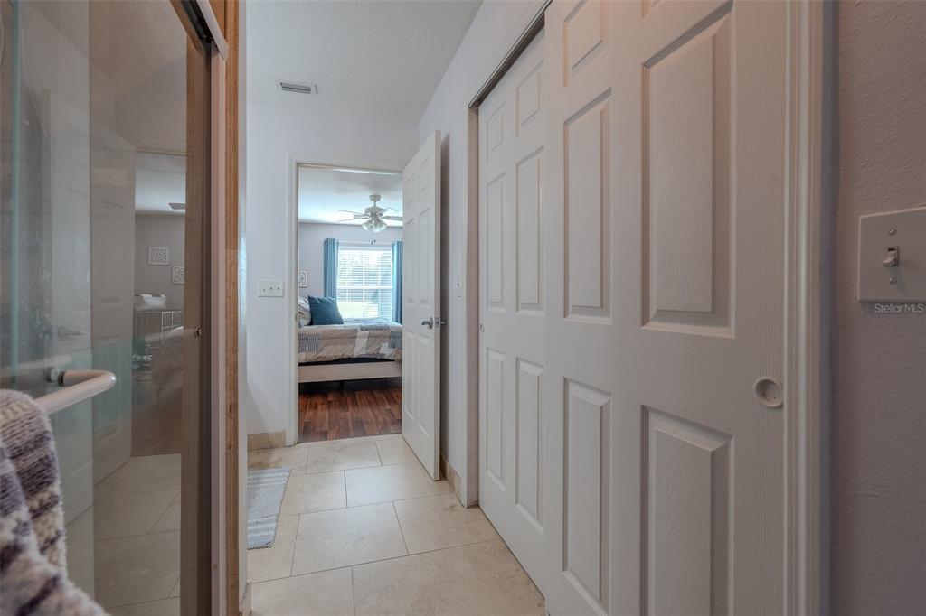 15143 Southwest 14th Avenue Road Ocala, FL 34473 - Photo 25 of 53 a view of a bedroom from a hallway