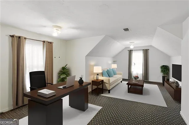 a living room with furniture a table and a flat screen tv