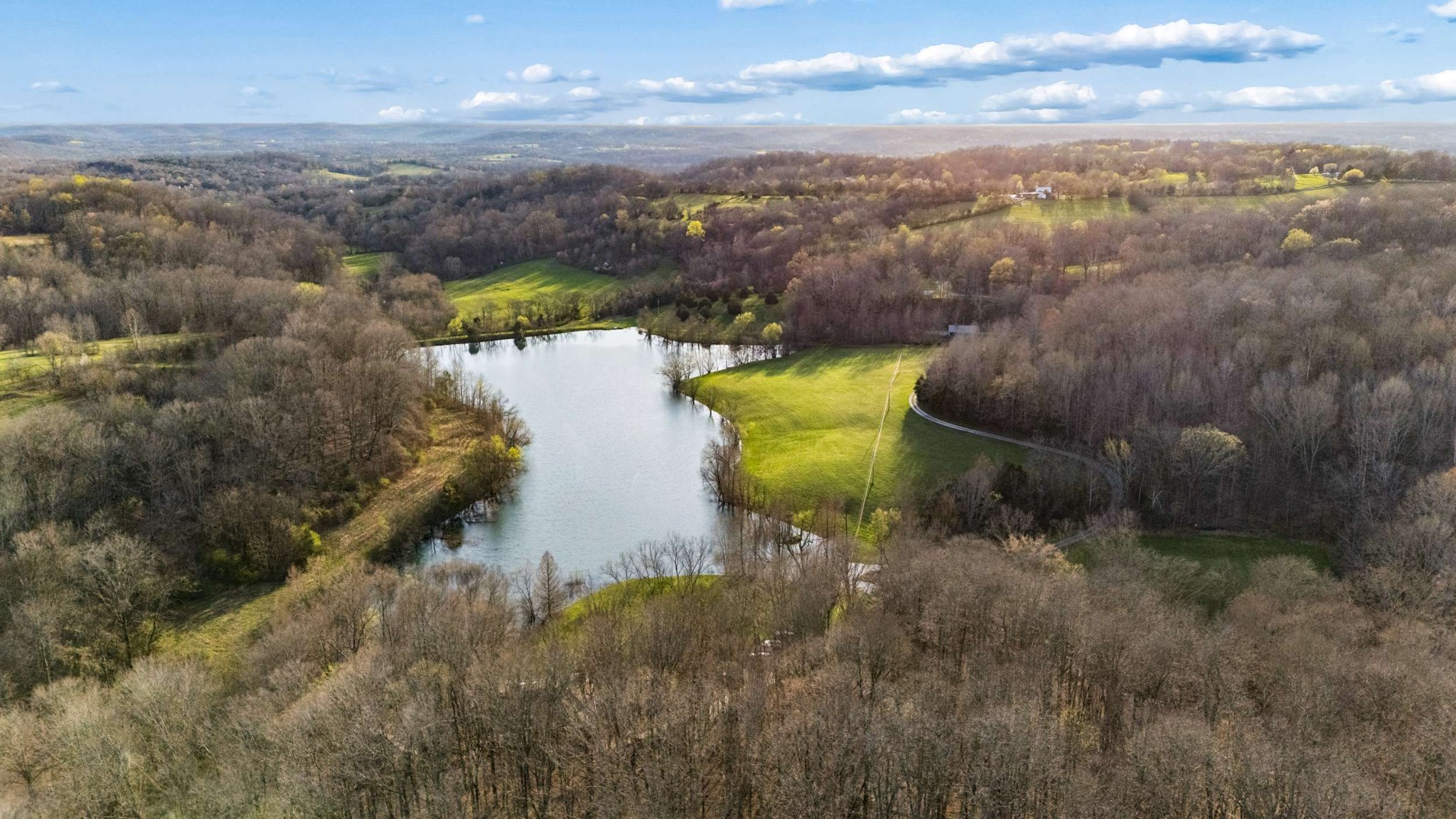 697 Johnson Branch Road Williamsport, TN 38487 - Photo 16 of 31 a view of a lake in middle of the town