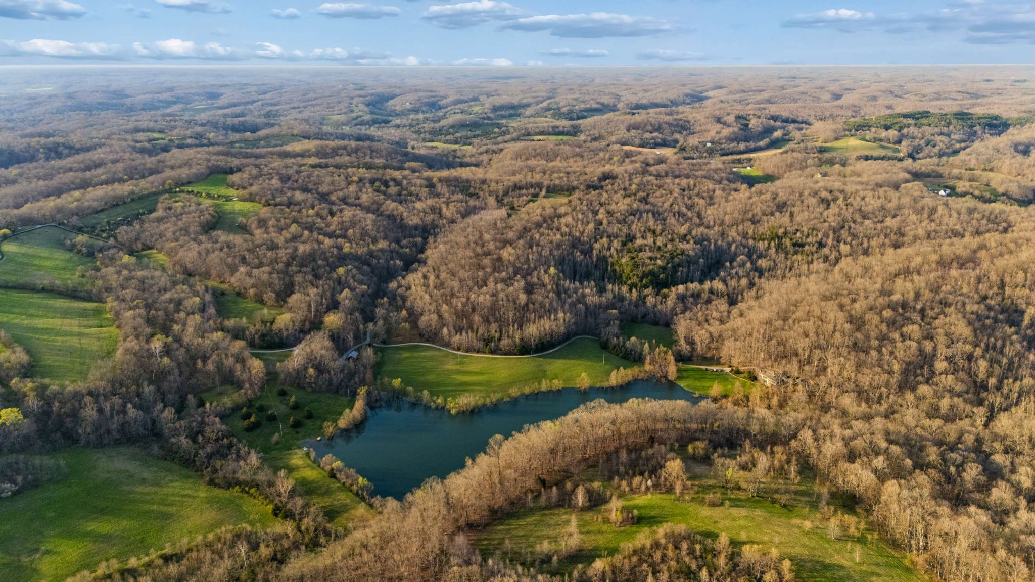 697 Johnson Branch Road Williamsport, TN 38487 - Photo 20 of 31 a view of a lake with beach and outdoor space