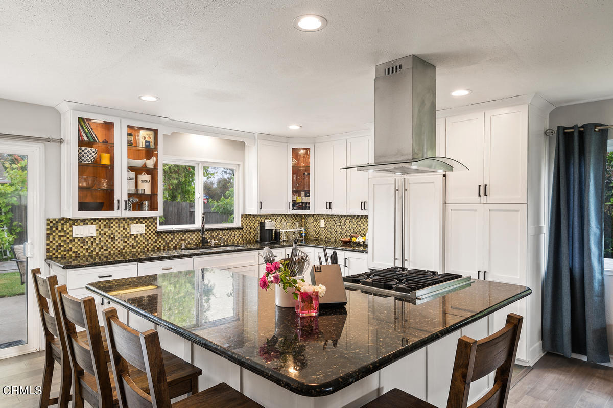 1540 Port Drive Oxnard, CA 93035 - Photo 14 of 39 a kitchen with stainless steel appliances granite countertop a stove and white refrigerator