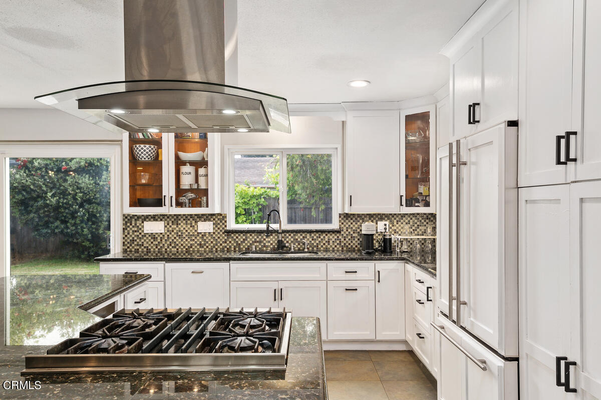 1540 Port Drive Oxnard, CA 93035 - Photo 16 of 39 a kitchen with stainless steel appliances granite countertop a sink stove and refrigerator