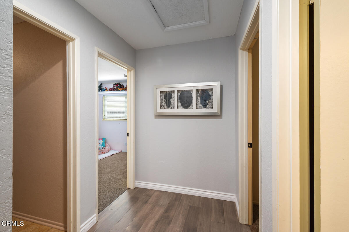 1540 Port Drive Oxnard, CA 93035 - Photo 26 of 39 a view of a hallway with wooden floor and closet