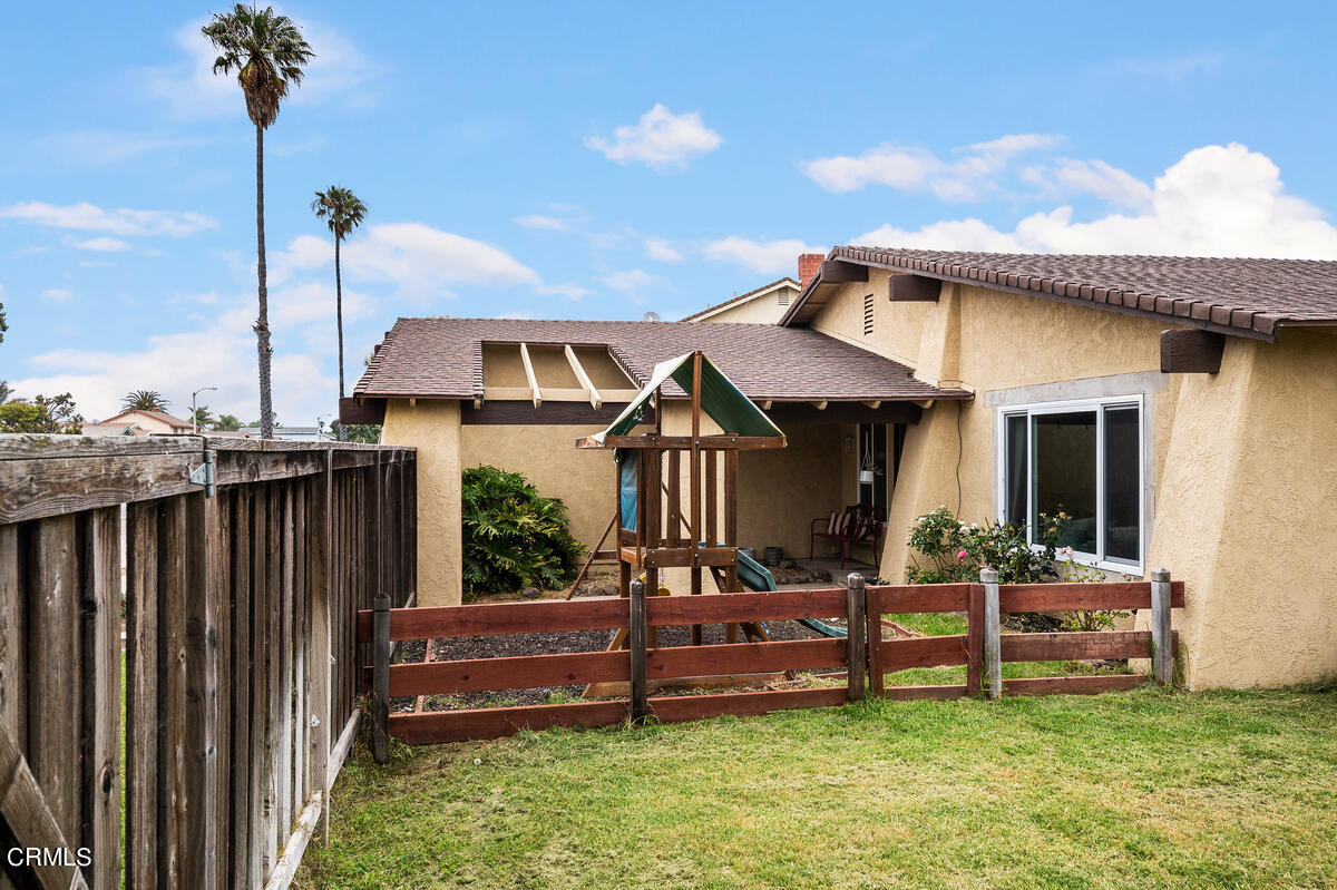 1540 Port Drive Oxnard, CA 93035 - Photo 37 of 39 a view of a house with a chairs in a patio
