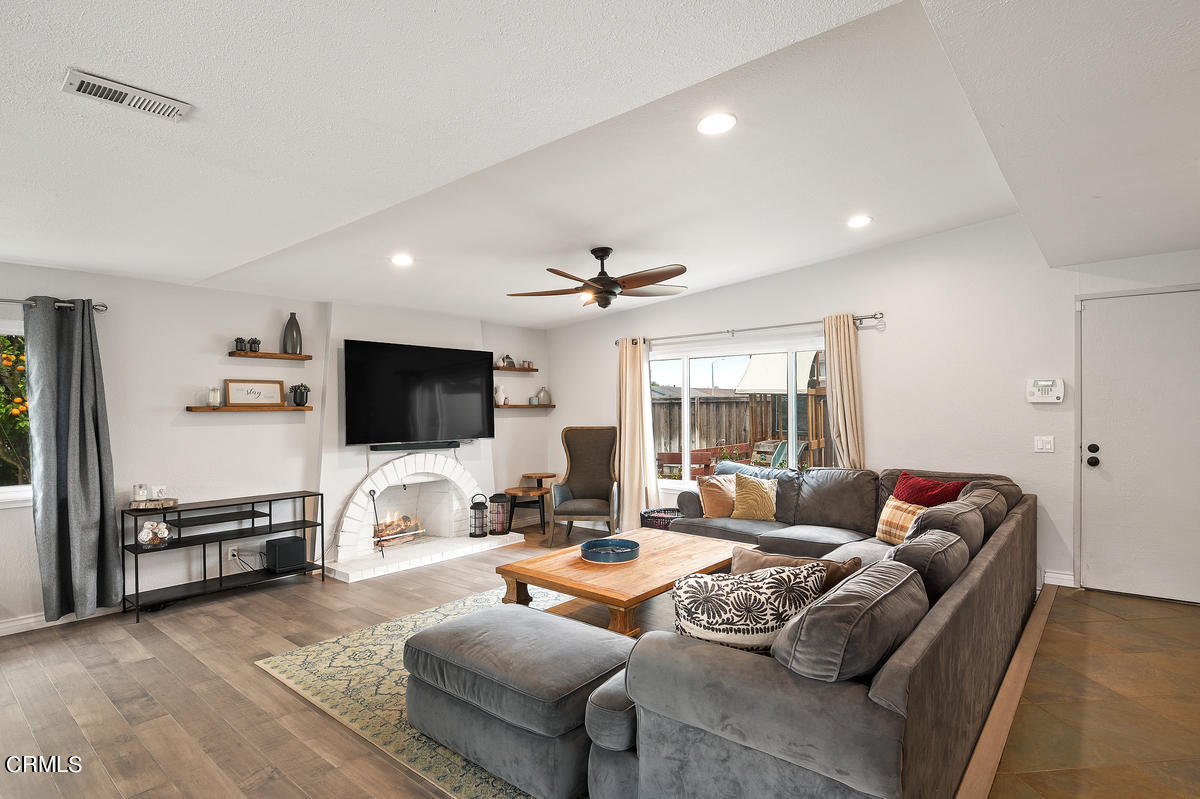 1540 Port Drive Oxnard, CA 93035 - Photo 8 of 39 a living room with furniture and a flat screen tv