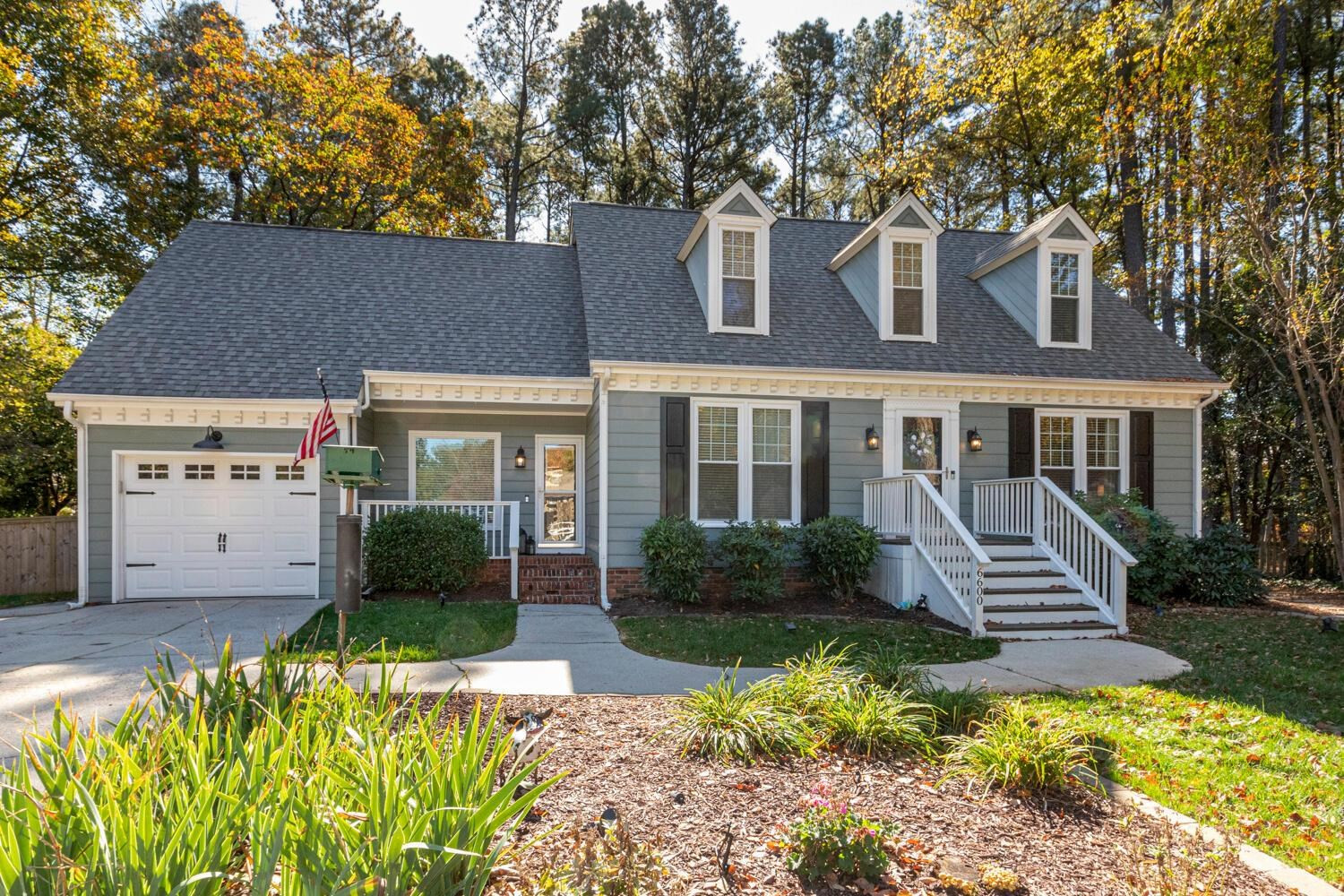 6600 Vancouver Lane Raleigh, NC 27615 - Photo 2 of 53 a front view of a house with a yard and outdoor seating