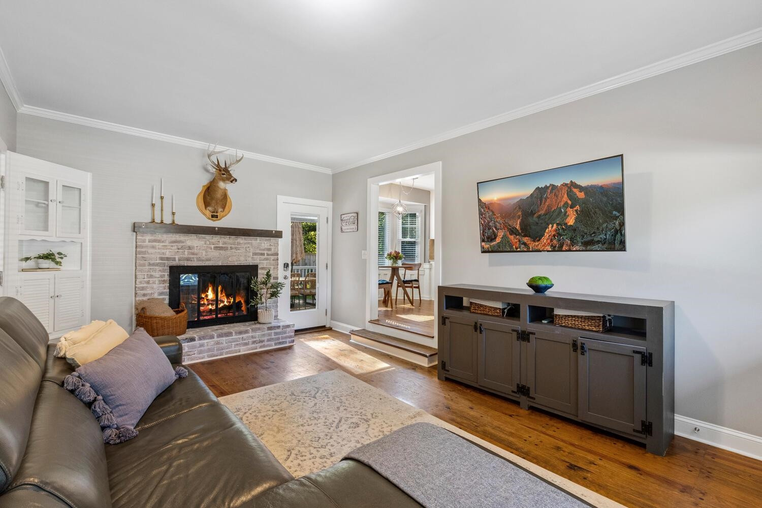 6600 Vancouver Lane Raleigh, NC 27615 - Photo 24 of 53 a living room with furniture a flat screen tv and a fireplace