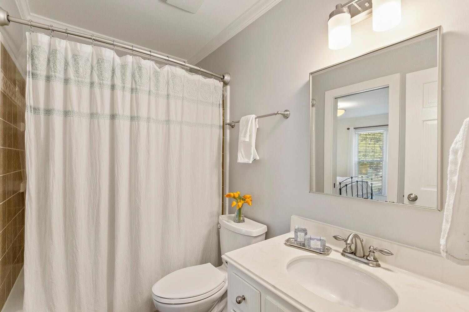 6600 Vancouver Lane Raleigh, NC 27615 - Photo 27 of 53 a bathroom with a sink a toilet and a mirror