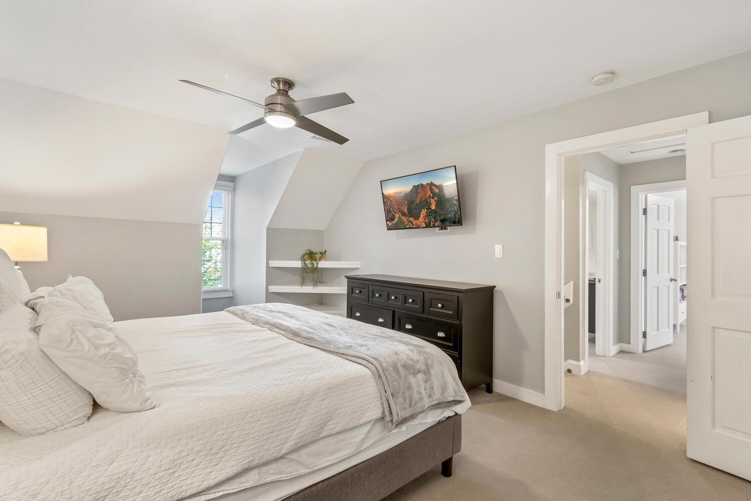 6600 Vancouver Lane Raleigh, NC 27615 - Photo 28 of 53 a bedroom with a bed and a chandelier
