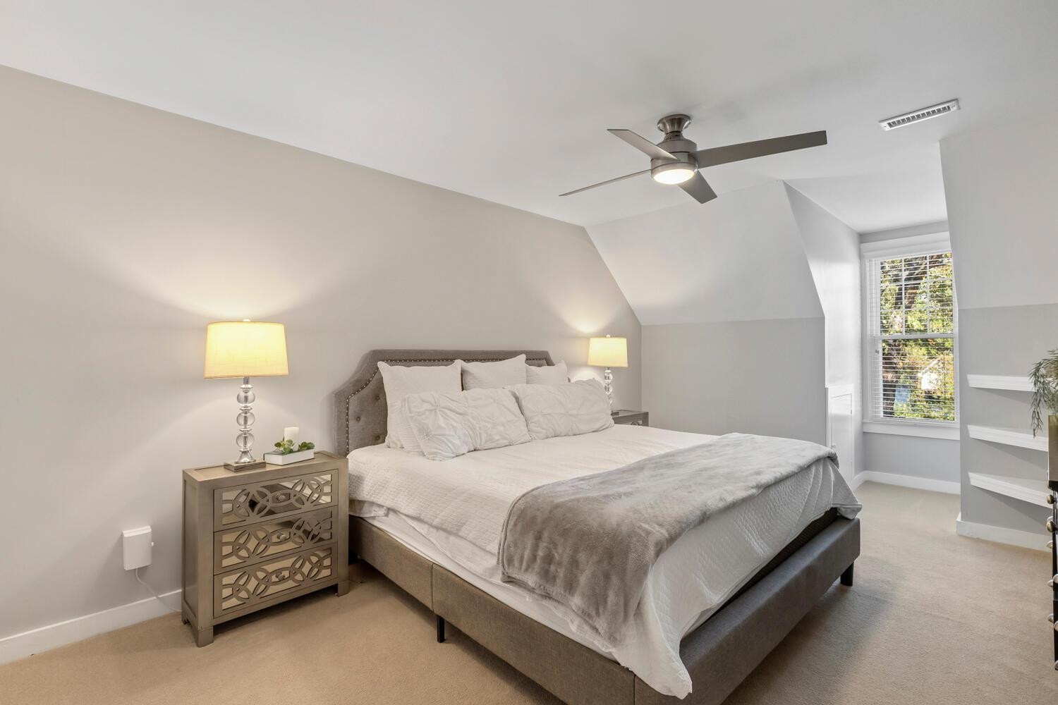 6600 Vancouver Lane Raleigh, NC 27615 - Photo 29 of 53 a bedroom with a bed and a night stand