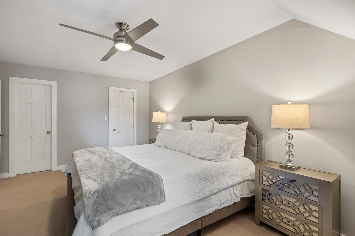 6600 Vancouver Lane Raleigh, NC 27615 - Photo 30 of 53 a bedroom with a bed and a lamp