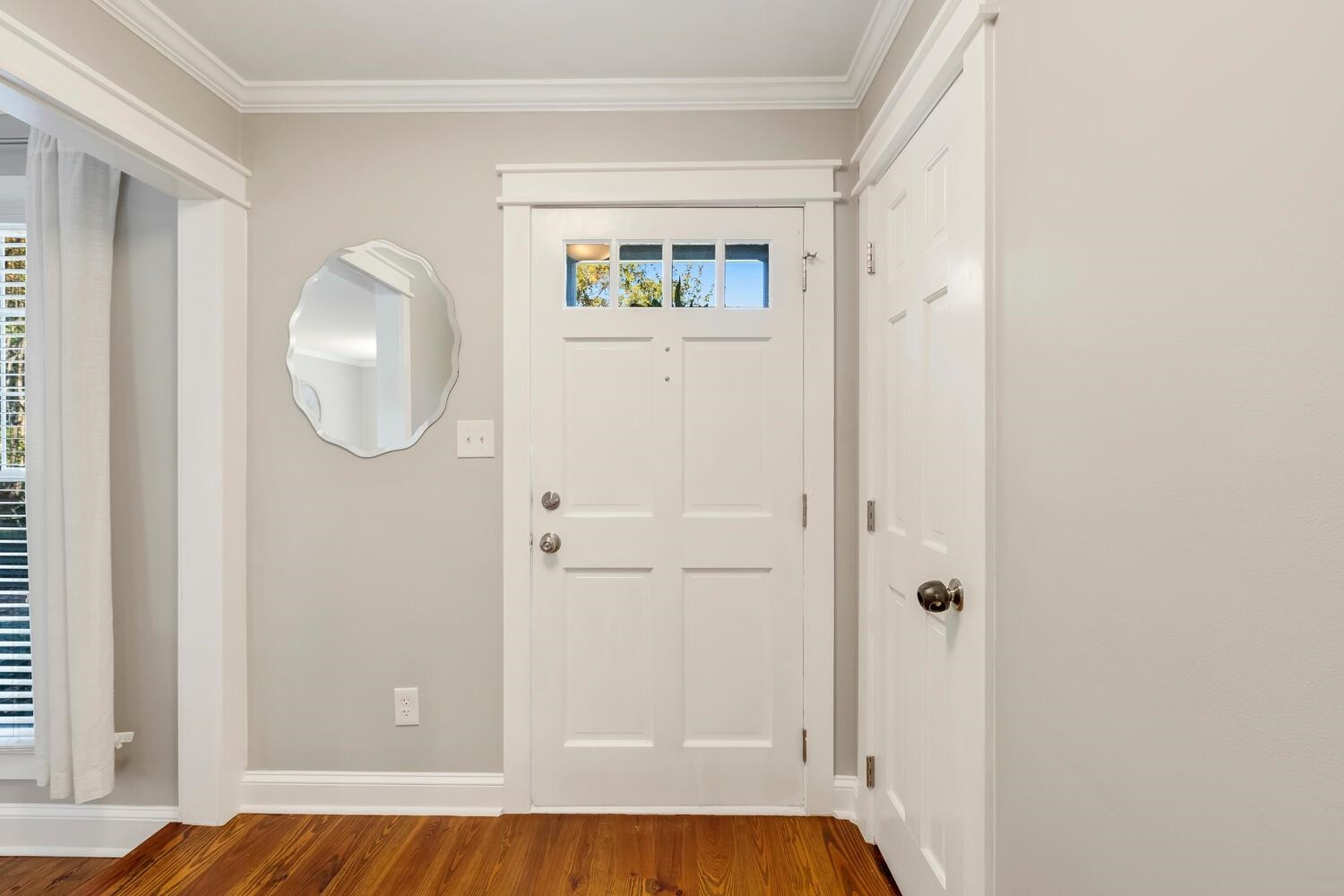 6600 Vancouver Lane Raleigh, NC 27615 - Photo 4 of 53 a view of a livingroom with wooden floor and a bathroom