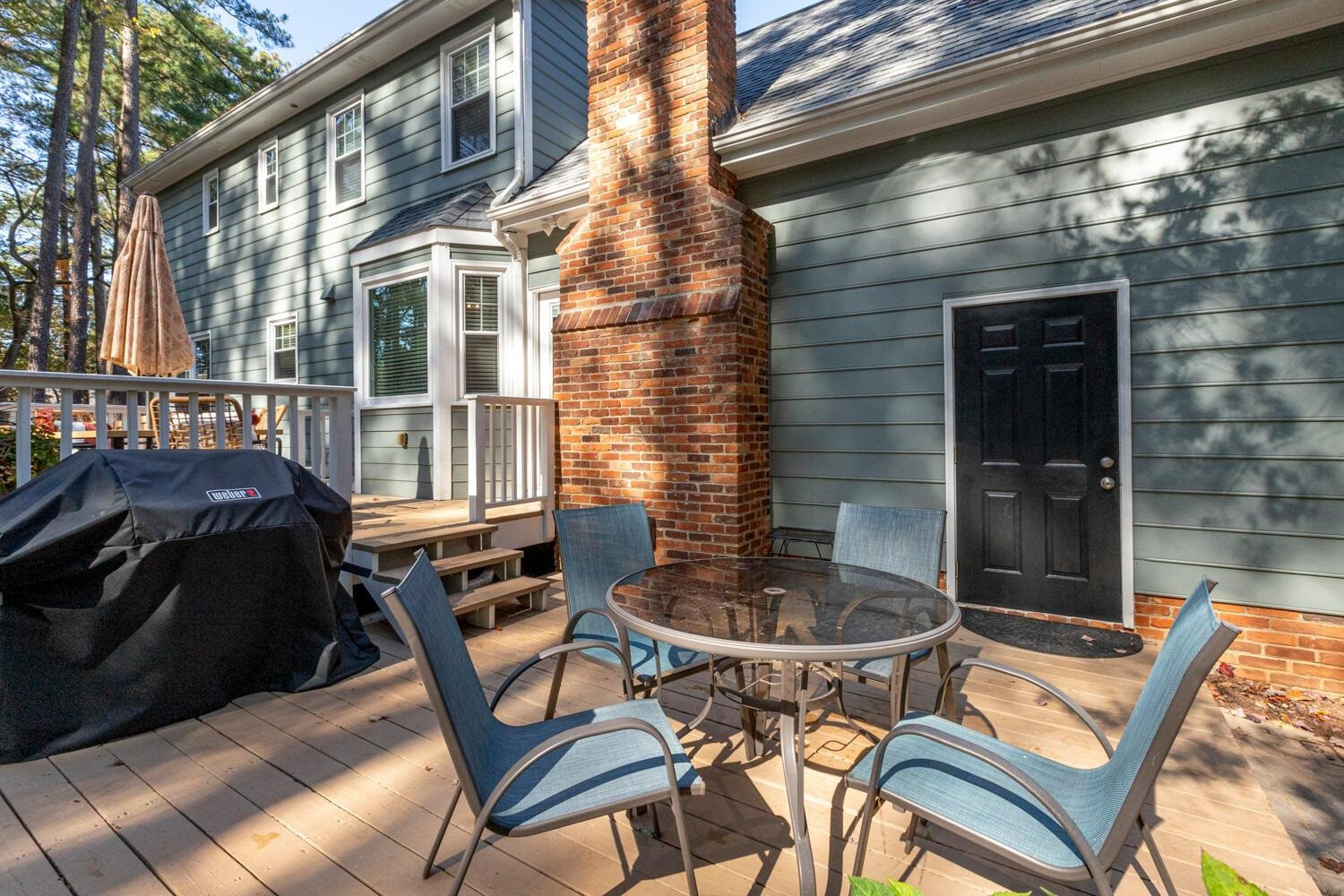 6600 Vancouver Lane Raleigh, NC 27615 - Photo 42 of 53 a backyard of a house with table and chairs
