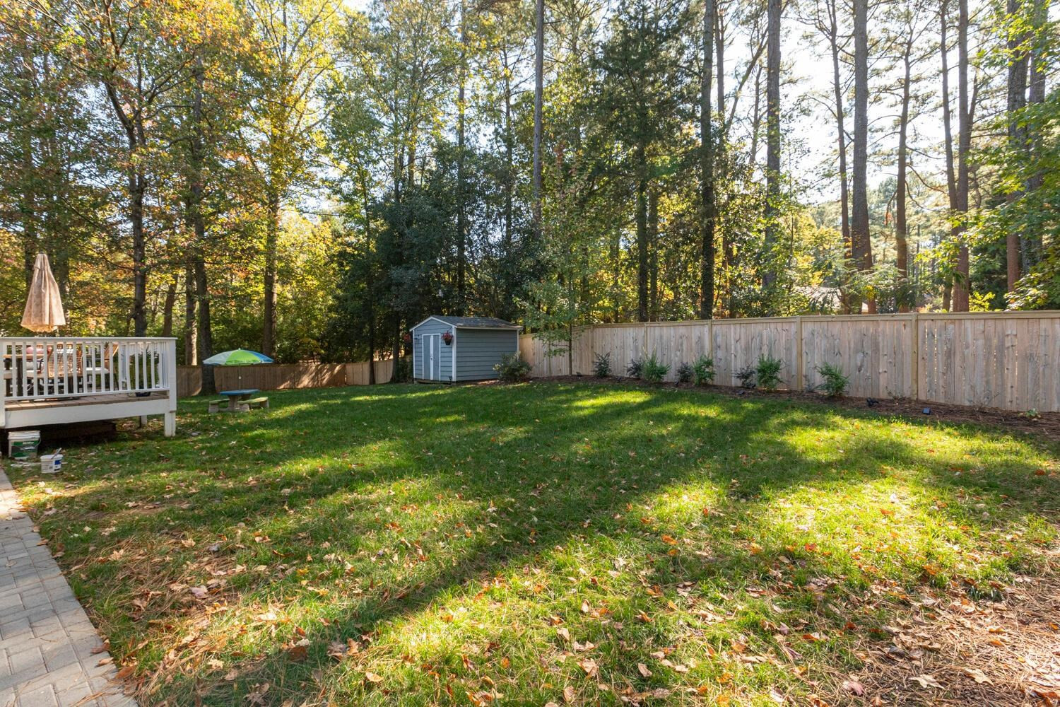 6600 Vancouver Lane Raleigh, NC 27615 - Photo 47 of 53 a view of swimming pool with garden and trees