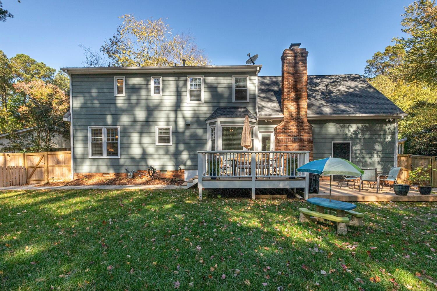 6600 Vancouver Lane Raleigh, NC 27615 - Photo 51 of 53 a front view of a house with a garden and sitting area