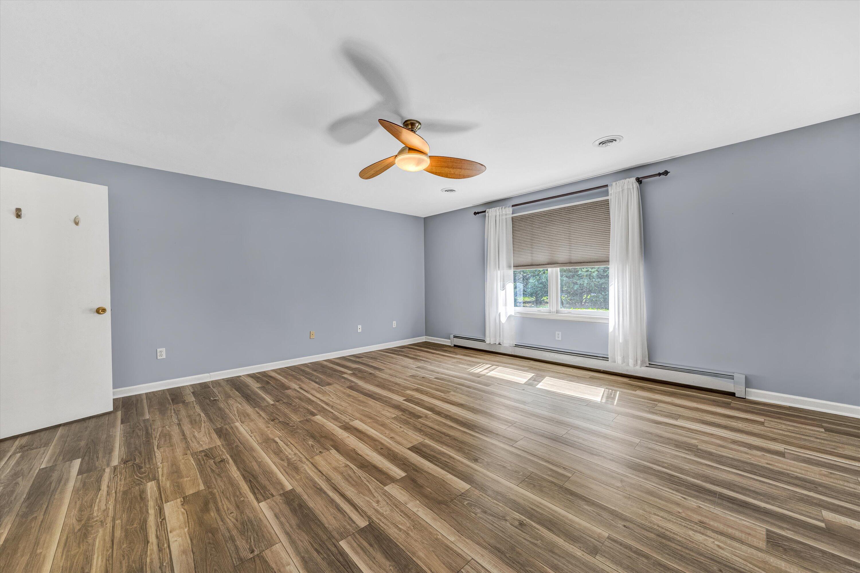 395 Middle Valley Road Hardy, VA 24101 - Photo 22 of 66 a view of an empty room with window and wooden floor