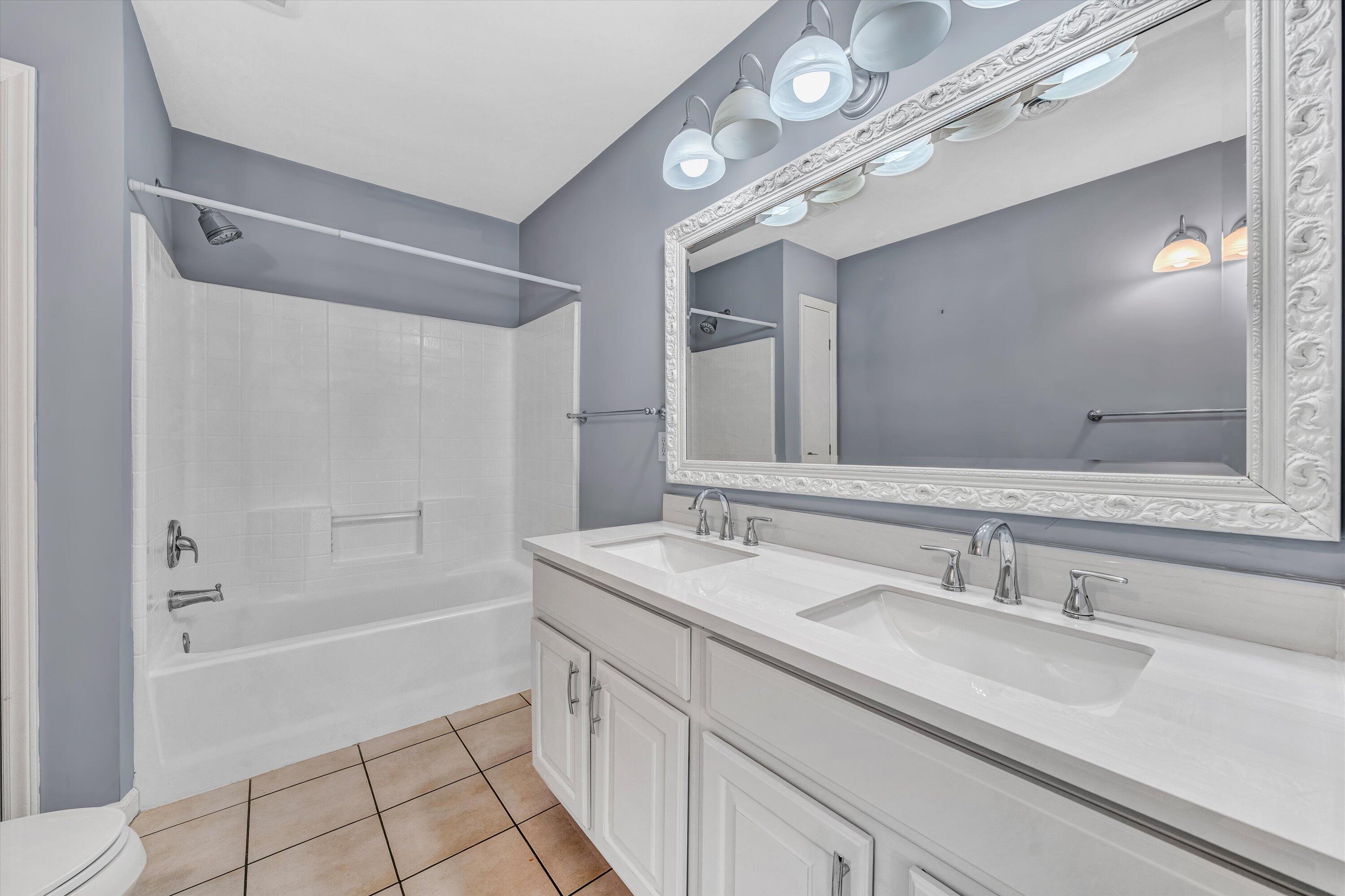 395 Middle Valley Road Hardy, VA 24101 - Photo 24 of 66 a bathroom with a sink double vanity mirror and a bathtub