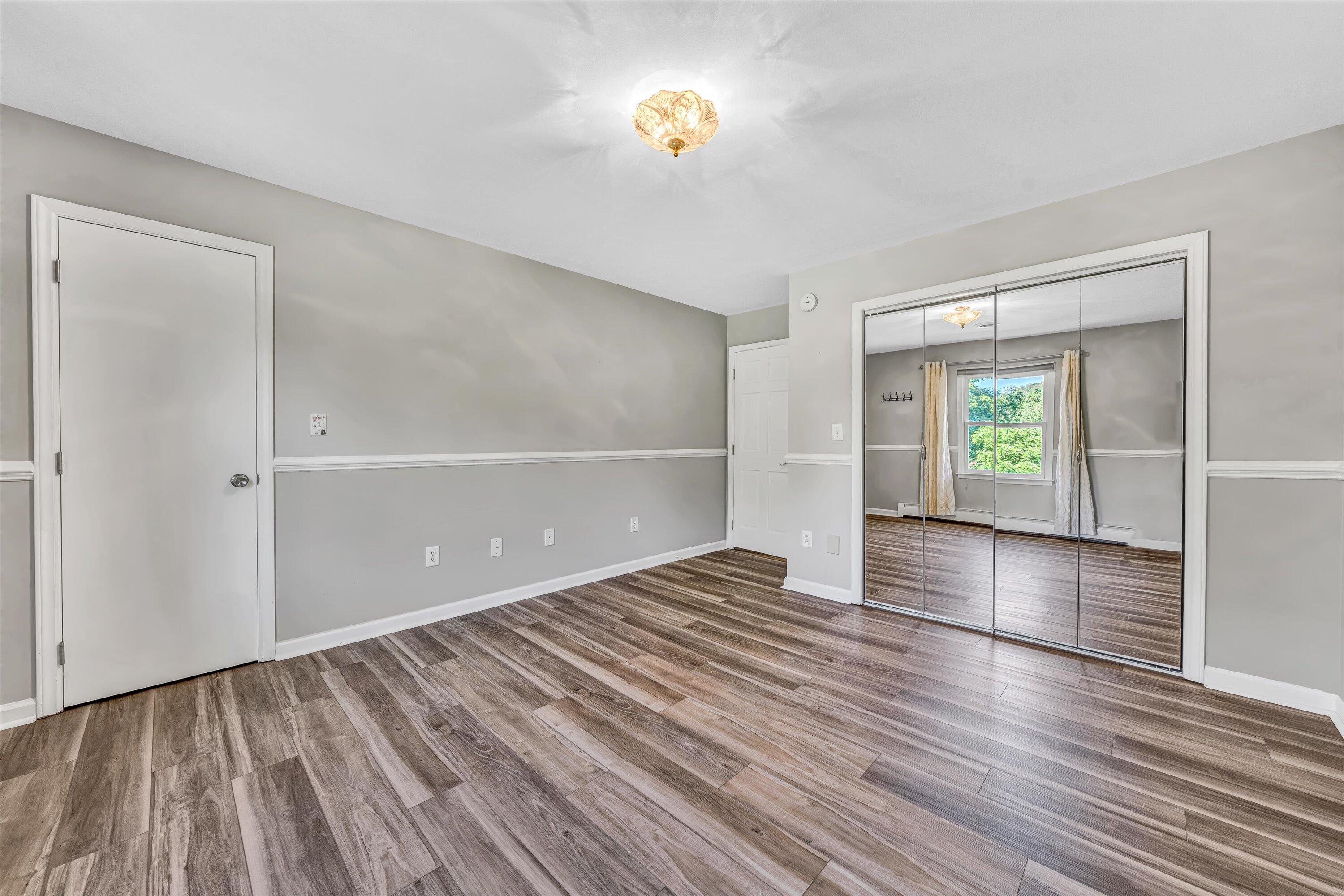 395 Middle Valley Road Hardy, VA 24101 - Photo 27 of 66 wooden floor in an empty room with a window
