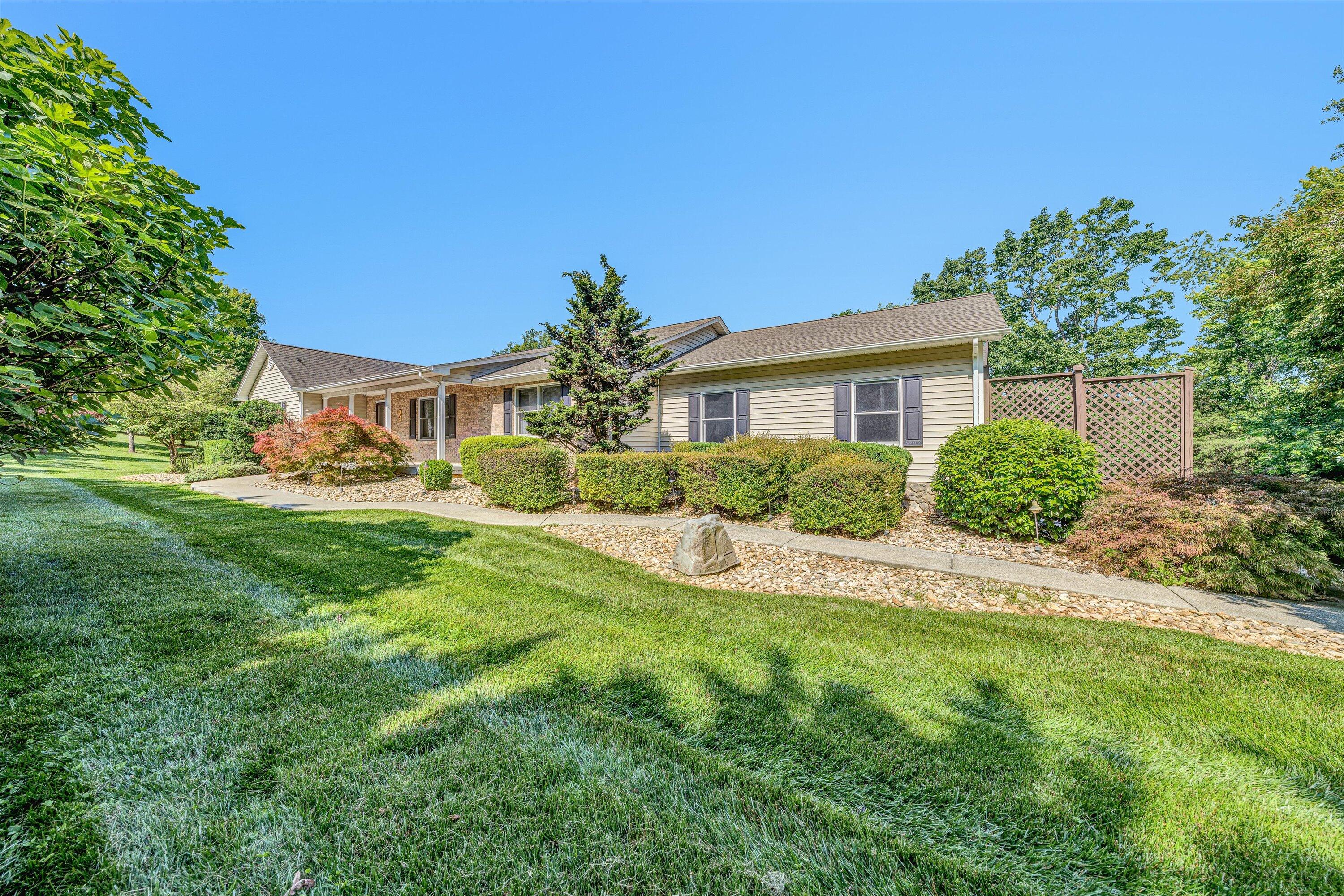 395 Middle Valley Road Hardy, VA 24101 - Photo 3 of 66 a front view of a house with a yard