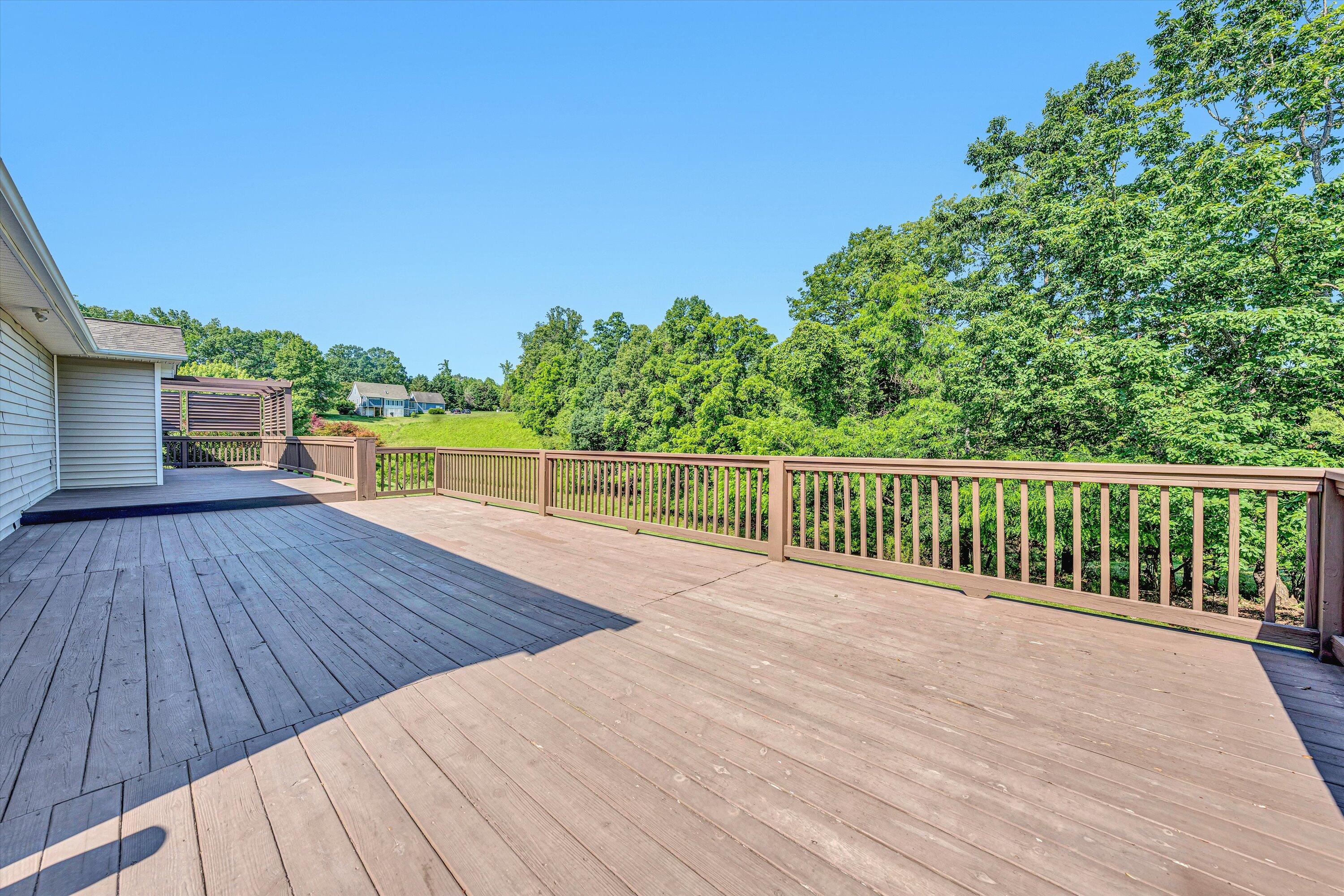 395 Middle Valley Road Hardy, VA 24101 - Photo 32 of 66 a view of a balcony with wooden floor and fence