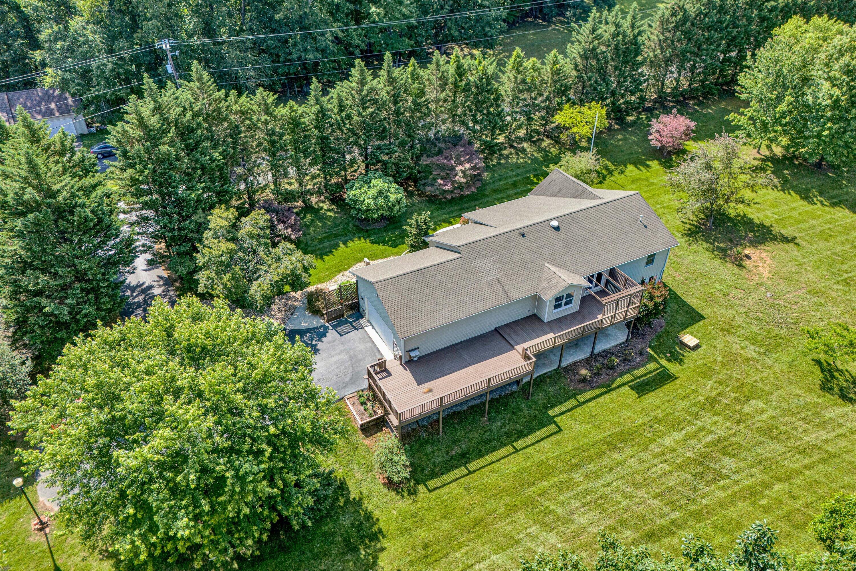 395 Middle Valley Road Hardy, VA 24101 - Photo 49 of 66 an aerial view of a house with a yard