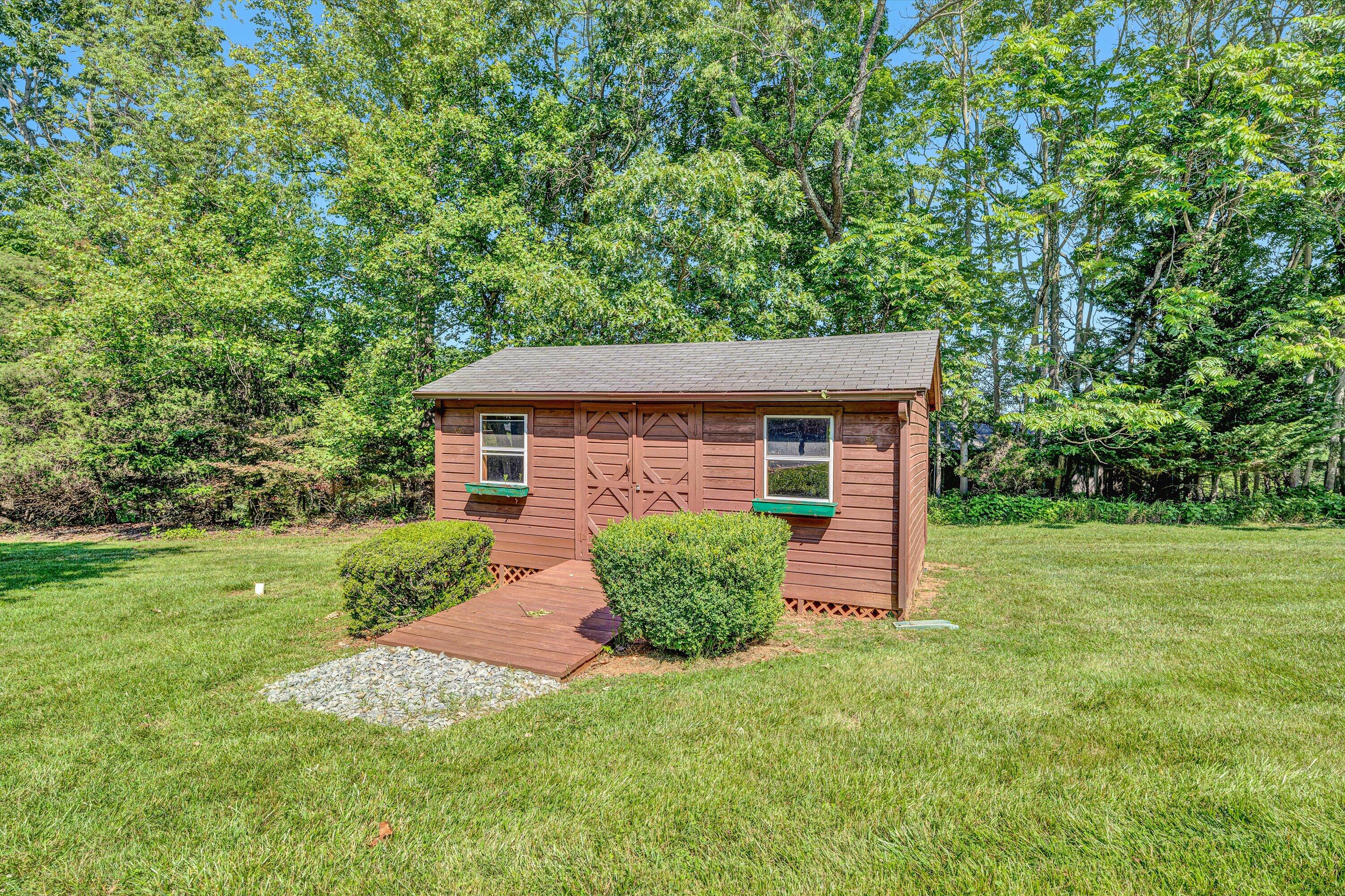 395 Middle Valley Road Hardy, VA 24101 - Photo 54 of 66 a front view of a house with garden