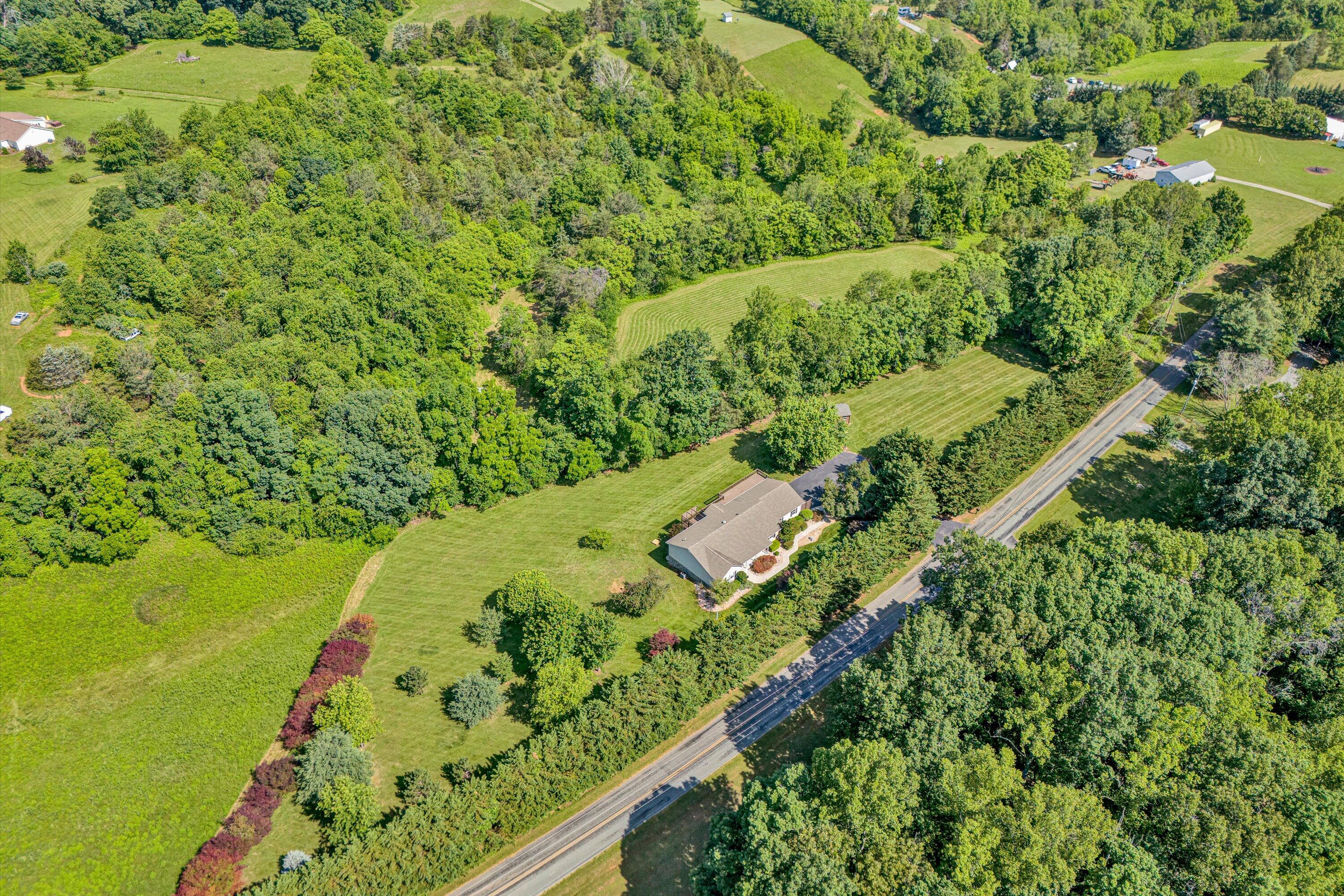 395 Middle Valley Road Hardy, VA 24101 - Photo 59 of 66 a view of a yard with an trees