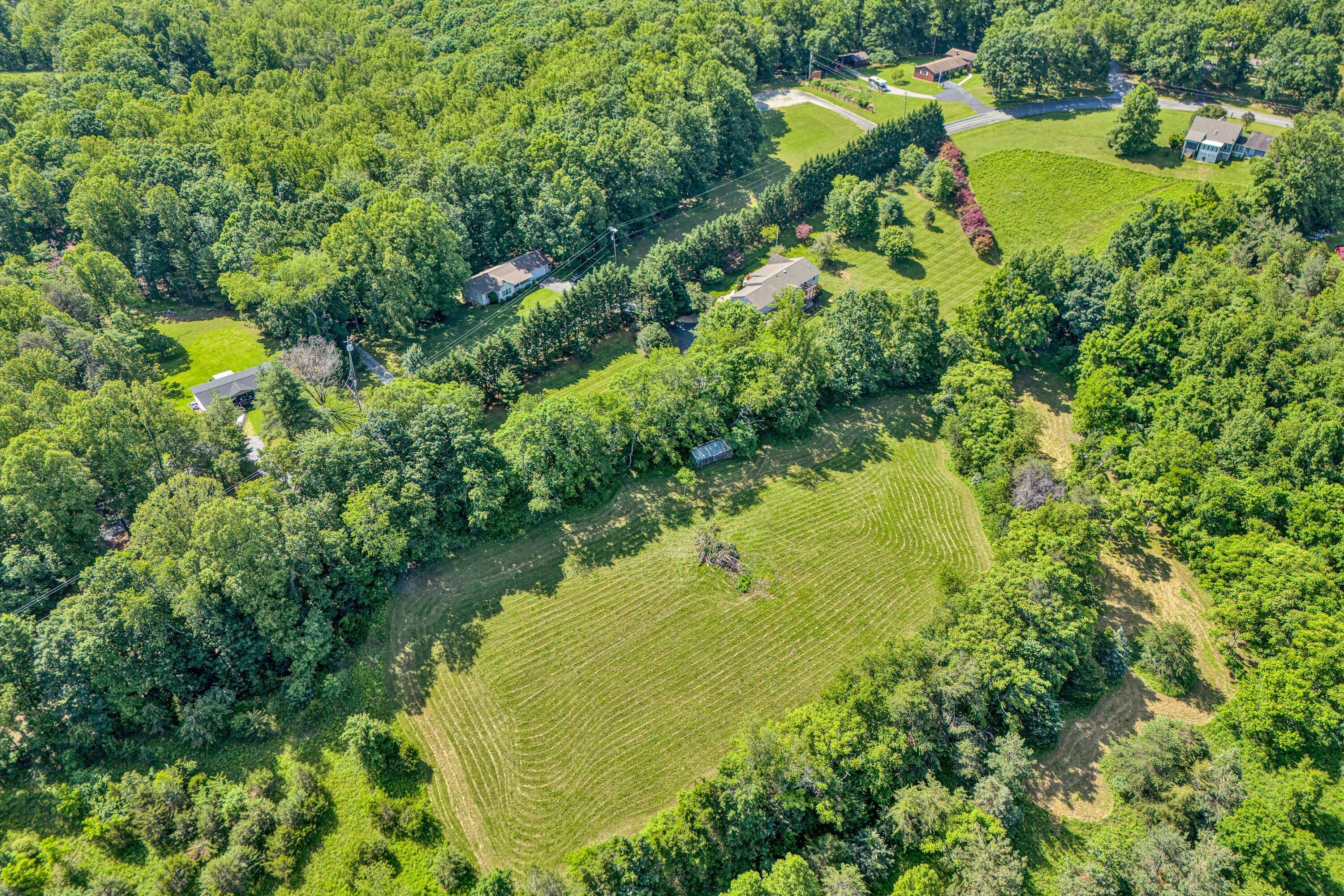 395 Middle Valley Road Hardy, VA 24101 - Photo 62 of 66 a view of a lake with a yard