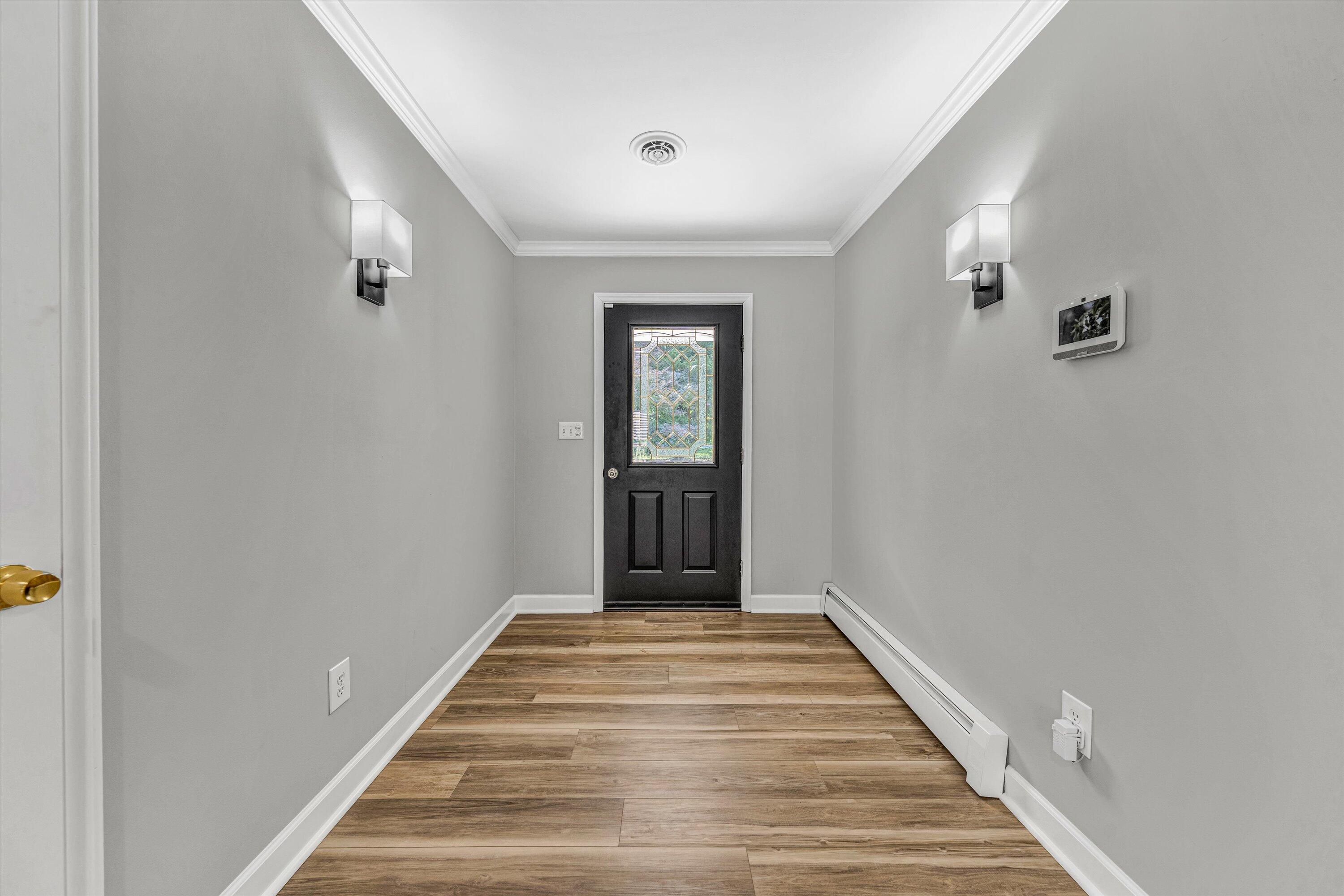 395 Middle Valley Road Hardy, VA 24101 - Photo 7 of 66 a view of a hallway with wooden floor and closet