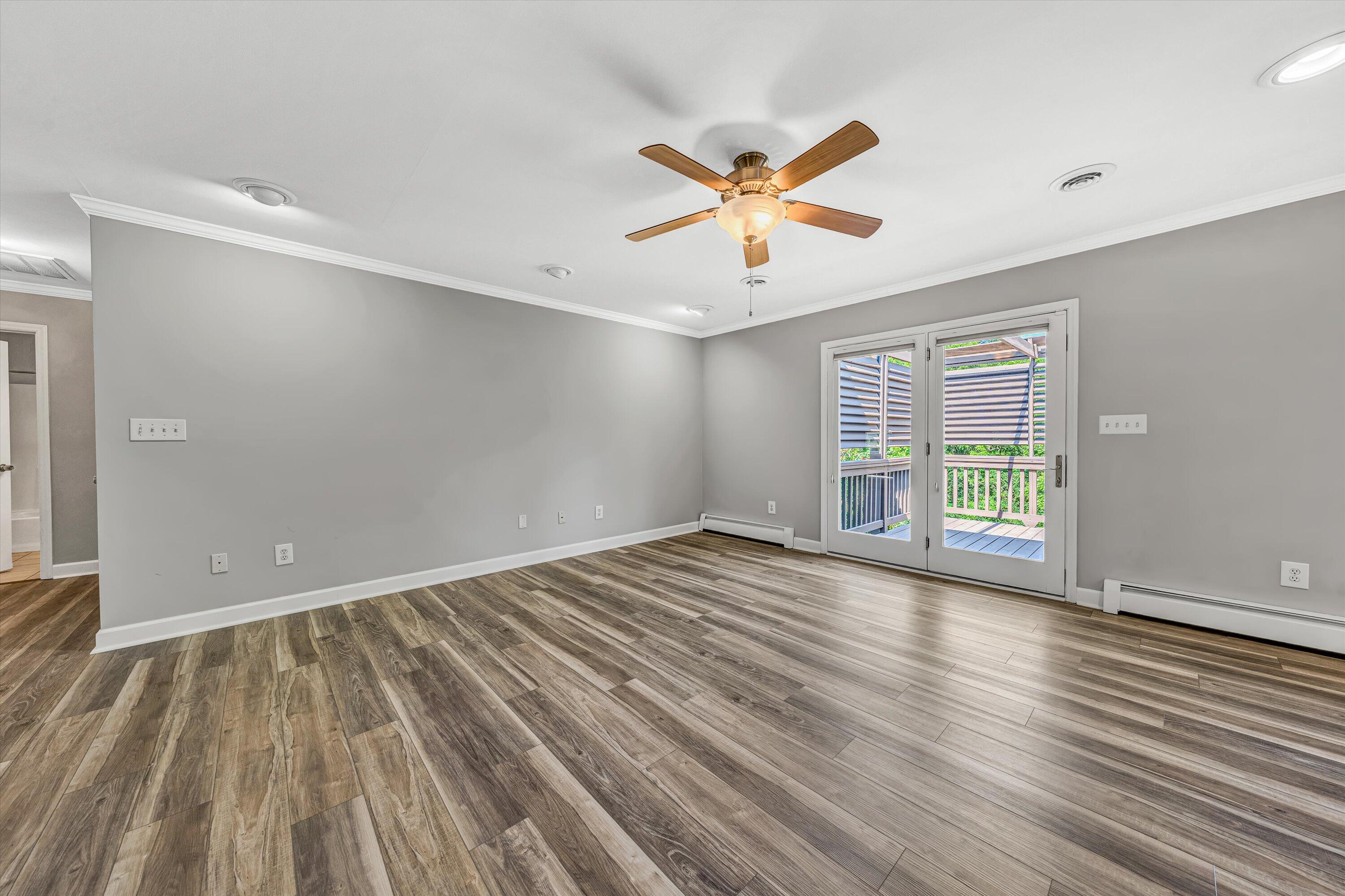 395 Middle Valley Road Hardy, VA 24101 - Photo 10 of 66 wooden floor in an empty room with a window