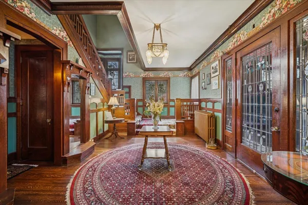a living room with lots of furniture and a rug