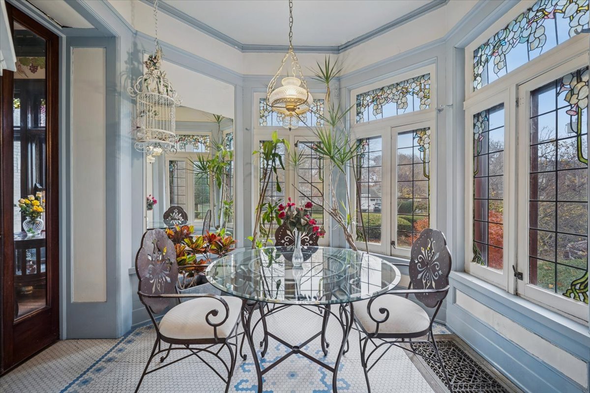 305 Oregon Avenue West Dundee, IL 60118 - Photo 21 of 68 a dining room with furniture a chandelier and wooden floor