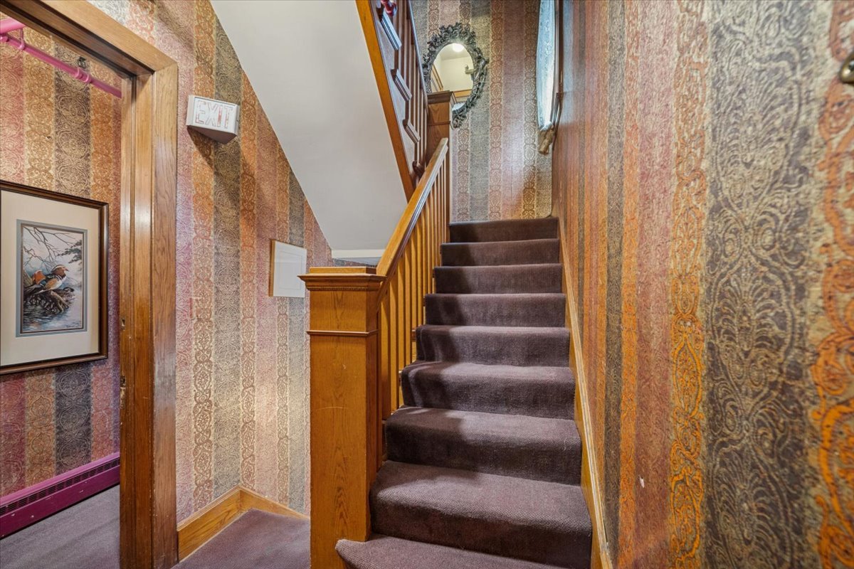 305 Oregon Avenue West Dundee, IL 60118 - Photo 24 of 68 a view of staircase with wooden floor and windows