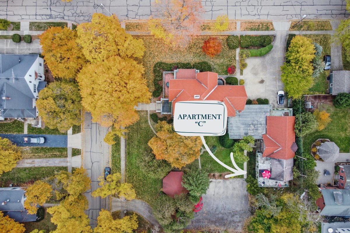 305 Oregon Avenue West Dundee, IL 60118 - Photo 36 of 68 a sign that is sitting on a brick wall