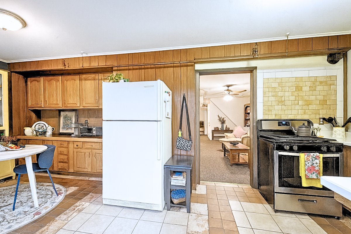 305 Oregon Avenue West Dundee, IL 60118 - Photo 39 of 68 a kitchen with stainless steel appliances granite countertop a refrigerator and a stove top oven