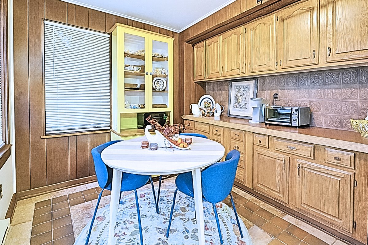 305 Oregon Avenue West Dundee, IL 60118 - Photo 40 of 68 a kitchen with stainless steel appliances granite countertop a dining table and chairs with wooden floor