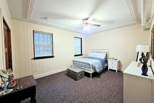 a room with a dresser and a window