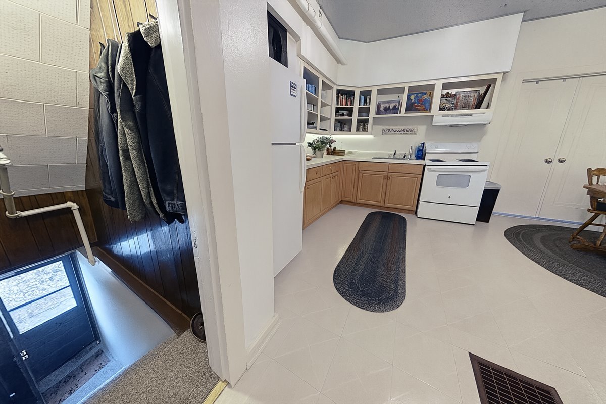305 Oregon Avenue West Dundee, IL 60118 - Photo 46 of 68 a kitchen with stainless steel appliances granite countertop a sink a stove and a refrigerator