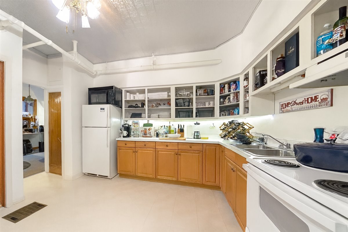 305 Oregon Avenue West Dundee, IL 60118 - Photo 47 of 68 a kitchen with stainless steel appliances granite countertop a stove and a refrigerator