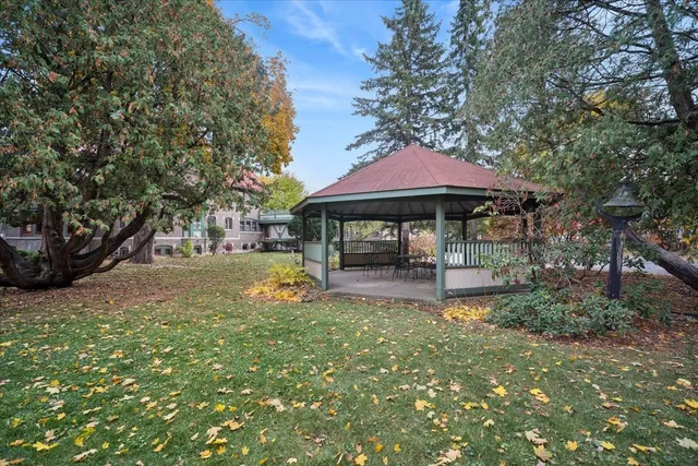a view of a house with backyard porch and sitting area