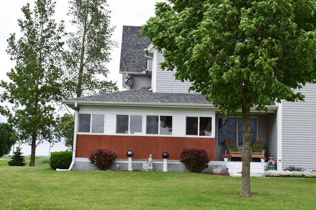 16152 University Road Malta, IL 60150 - Photo 21 of 24 a front view of house with yard and green space