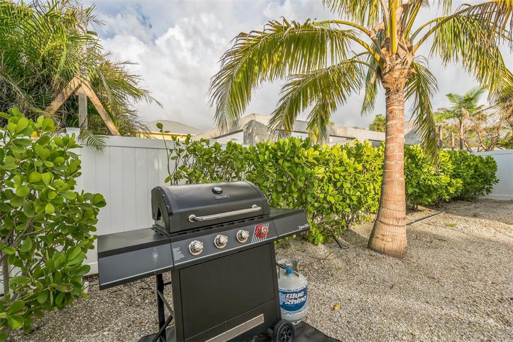 305 73rd Street Holmes Beach, FL 34217 - Photo 18 of 59 a view of a yard with a chair