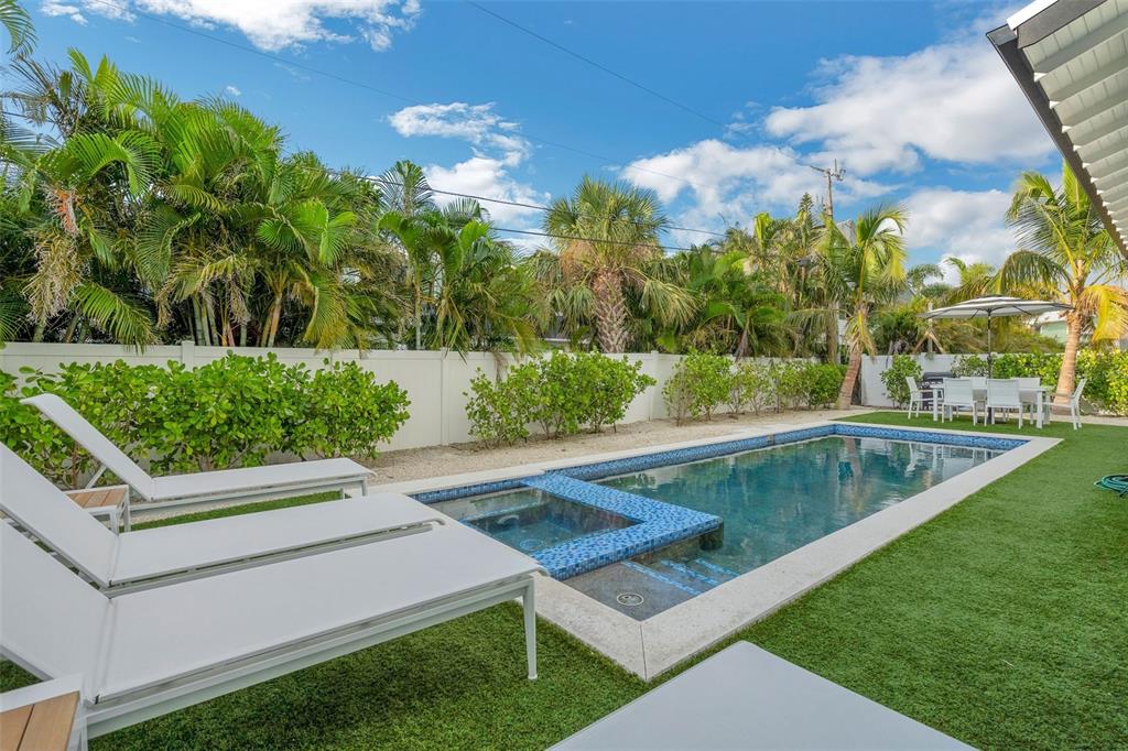 305 73rd Street Holmes Beach, FL 34217 - Photo 27 of 59 a view of a backyard with swimming pool