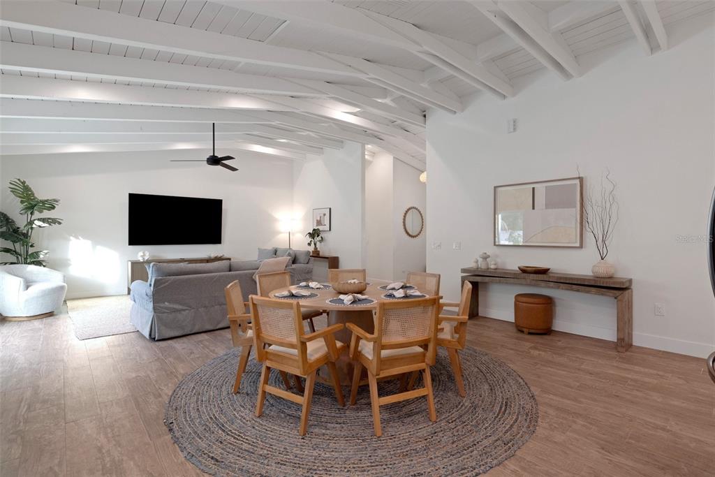 305 73rd Street Holmes Beach, FL 34217 - Photo 39 of 59 a view of a dining room with furniture and wooden floor